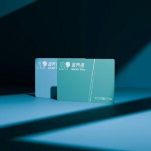 Two macau pass cards with blue and green backgrounds.